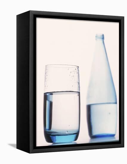 Bottle and glass of water-null-Framed Premier Image Canvas