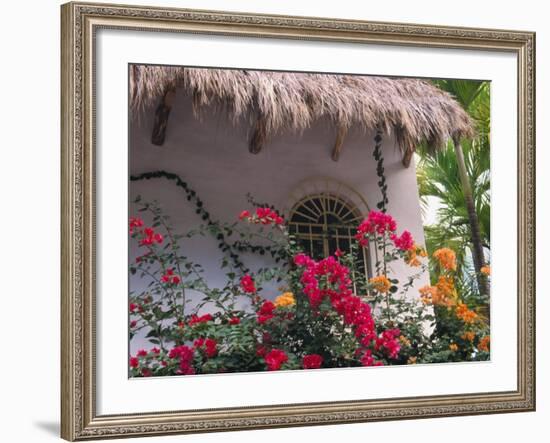 Bougenvilla Blooms Underneath a Thatch Roof, Puerto Vallarta, Mexico-Merrill Images-Framed Photographic Print