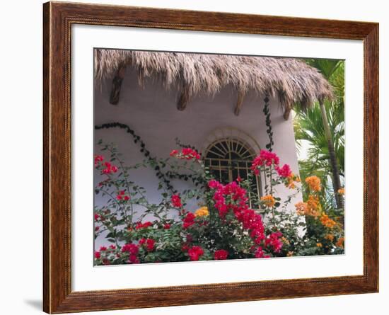 Bougenvilla Blooms Underneath a Thatch Roof, Puerto Vallarta, Mexico-Merrill Images-Framed Photographic Print