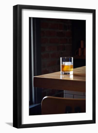 Bourbon In A Short Tumbler Glass On A Bar With A Large Ice Cube In The Glass-Shea Evans-Framed Photographic Print