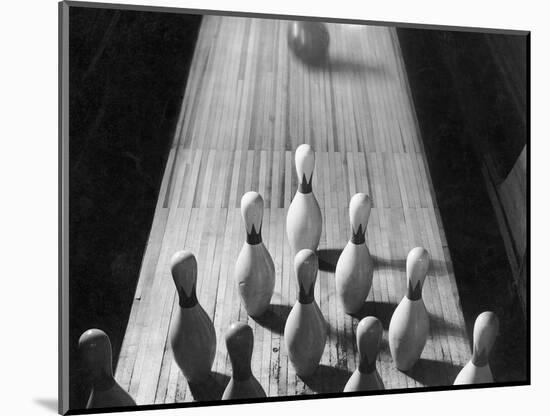 Bowling Ball Rolling Toward Pins-Philip Gendreau-Mounted Photographic Print