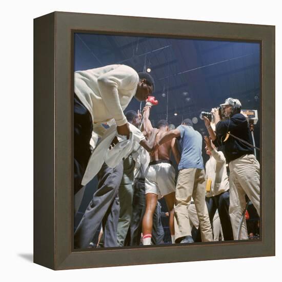 Boxer Cassius Clay, aka Muhammad Ali, Raising Fist in Triumph After Beating Sonny Liston-John Dominis-Framed Premier Image Canvas