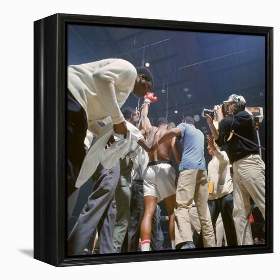 Boxer Cassius Clay, aka Muhammad Ali, Raising Fist in Triumph After Beating Sonny Liston-John Dominis-Framed Premier Image Canvas