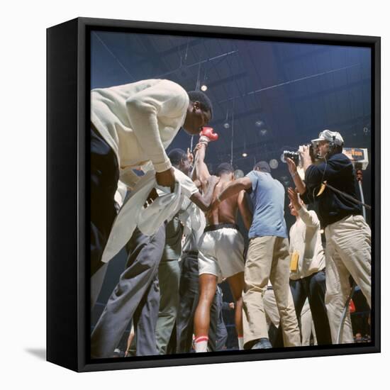 Boxer Cassius Clay, aka Muhammad Ali, Raising Fist in Triumph After Beating Sonny Liston-John Dominis-Framed Premier Image Canvas