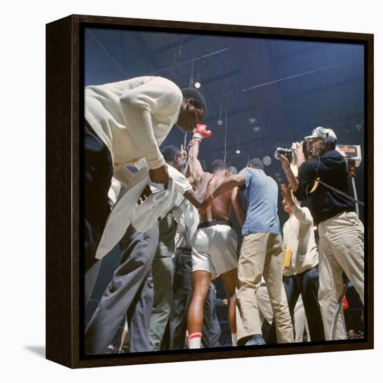 Boxer Cassius Clay, aka Muhammad Ali, Raising Fist in Triumph After Beating Sonny Liston-John Dominis-Framed Premier Image Canvas