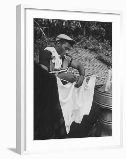 Boxer Floyd Patterson Doing Laundry at Training Quarters Near Newtown-George Silk-Framed Premium Photographic Print