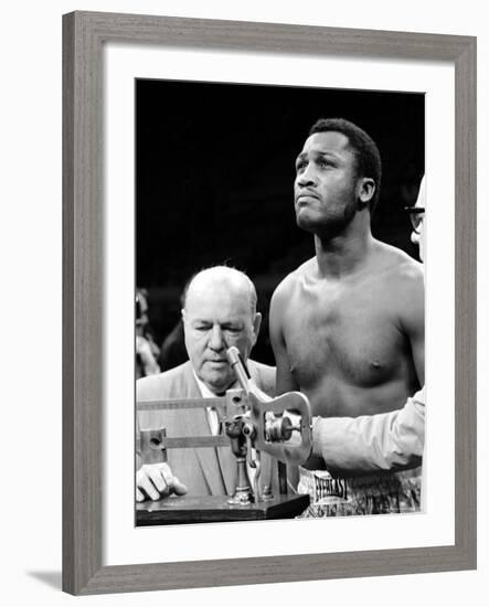 Boxer Joe Frazier at the Weigh in for His Fight Against Muhammad Ali-John Shearer-Framed Premium Photographic Print