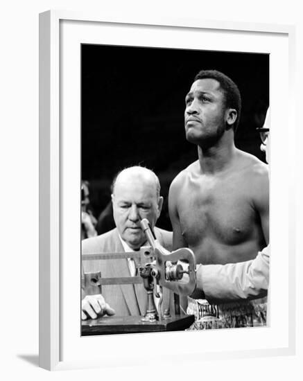 Boxer Joe Frazier at the Weigh in for His Fight Against Muhammad Ali-John Shearer-Framed Premium Photographic Print