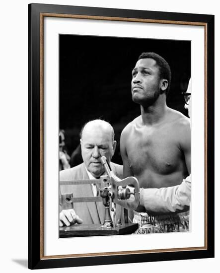 Boxer Joe Frazier at the Weigh in for His Fight Against Muhammad Ali-John Shearer-Framed Premium Photographic Print