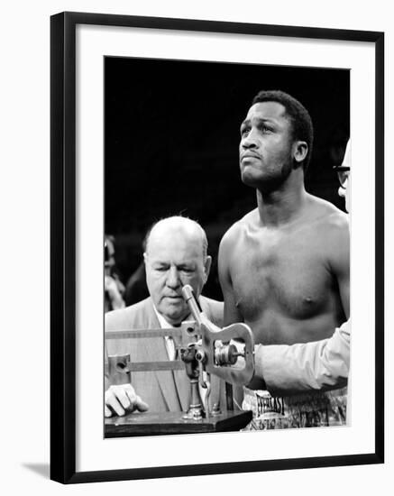 Boxer Joe Frazier at the Weigh in for His Fight Against Muhammad Ali-John Shearer-Framed Premium Photographic Print