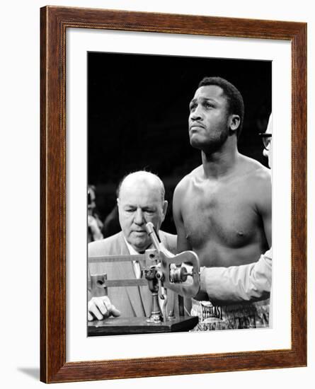 Boxer Joe Frazier at the Weigh in for His Fight Against Muhammad Ali-John Shearer-Framed Premium Photographic Print