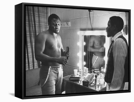 Boxer Joe Frazier Dressing During Training for a Fight Against Muhammad Ali-John Shearer-Framed Premier Image Canvas