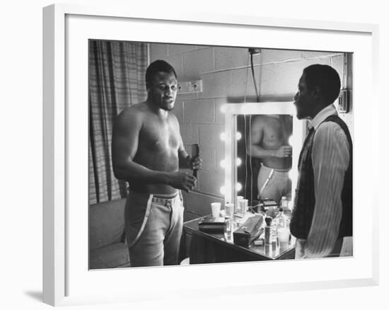 Boxer Joe Frazier Dressing During Training for a Fight Against Muhammad Ali-John Shearer-Framed Premium Photographic Print