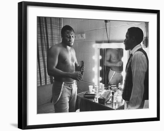 Boxer Joe Frazier Dressing During Training for a Fight Against Muhammad Ali-John Shearer-Framed Premium Photographic Print