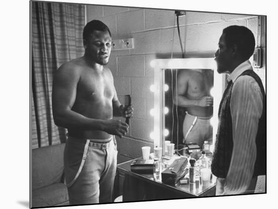 Boxer Joe Frazier Dressing During Training for a Fight Against Muhammad Ali-John Shearer-Mounted Premium Photographic Print