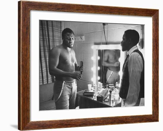 Boxer Joe Frazier Dressing During Training for a Fight Against Muhammad Ali-John Shearer-Framed Premium Photographic Print