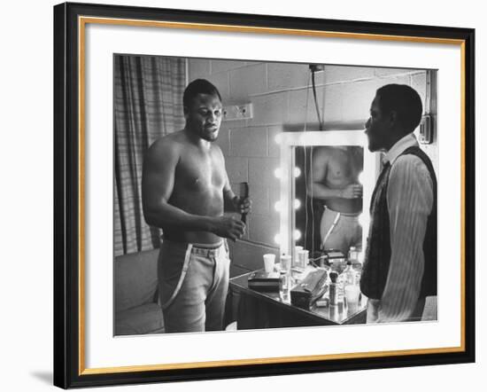 Boxer Joe Frazier Dressing During Training for a Fight Against Muhammad Ali-John Shearer-Framed Premium Photographic Print