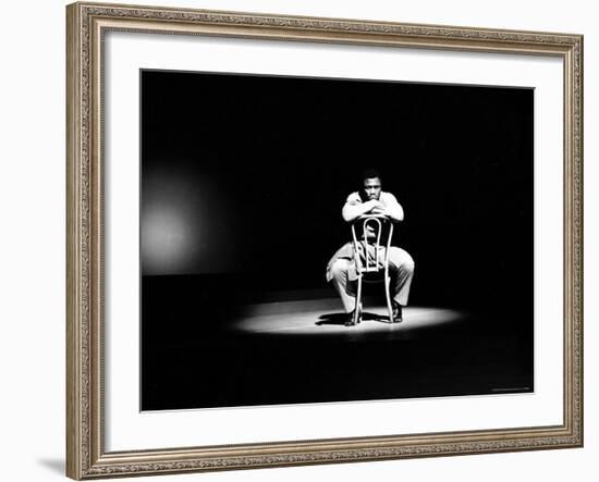 Boxer Joe Frazier Sitting on a Chair under a Spotlight-John Shearer-Framed Premium Photographic Print