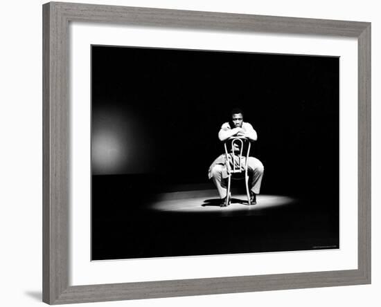 Boxer Joe Frazier Sitting on a Chair under a Spotlight-John Shearer-Framed Premium Photographic Print