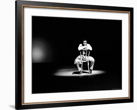 Boxer Joe Frazier Sitting on a Chair under a Spotlight-John Shearer-Framed Premium Photographic Print