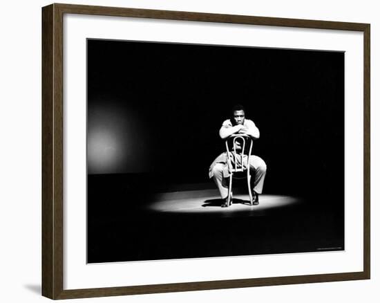 Boxer Joe Frazier Sitting on a Chair under a Spotlight-John Shearer-Framed Premium Photographic Print