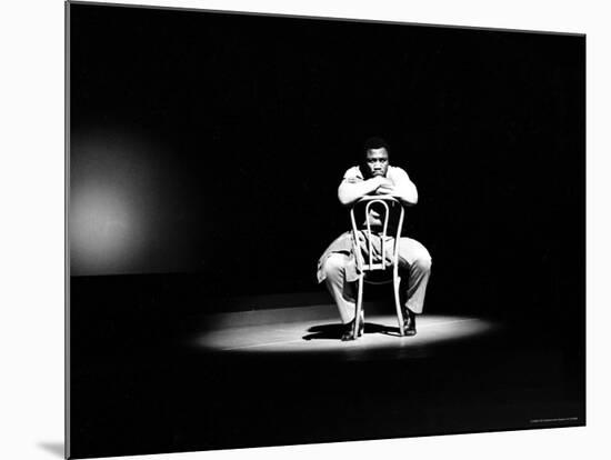 Boxer Joe Frazier Sitting on a Chair under a Spotlight-John Shearer-Mounted Premium Photographic Print