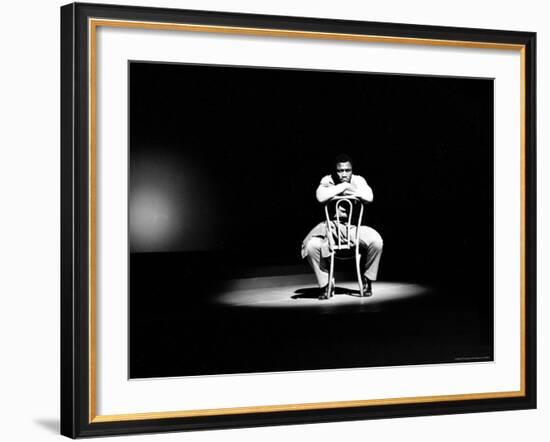 Boxer Joe Frazier Sitting on a Chair under a Spotlight-John Shearer-Framed Premium Photographic Print