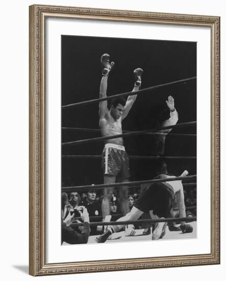 Boxer Muhammad Ali Raising His Gloves Victoriously After Knocking Out Oscar Bonavena-Bill Ray-Framed Premium Photographic Print