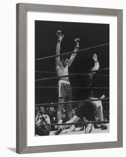 Boxer Muhammad Ali Raising His Gloves Victoriously After Knocking Out Oscar Bonavena-Bill Ray-Framed Premium Photographic Print