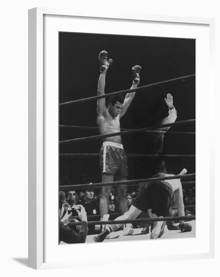 Boxer Muhammad Ali Raising His Gloves Victoriously After Knocking Out Oscar Bonavena-Bill Ray-Framed Premium Photographic Print