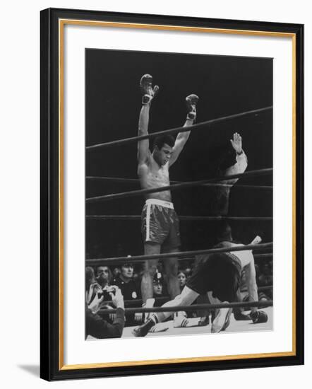 Boxer Muhammad Ali Raising His Gloves Victoriously After Knocking Out Oscar Bonavena-Bill Ray-Framed Premium Photographic Print