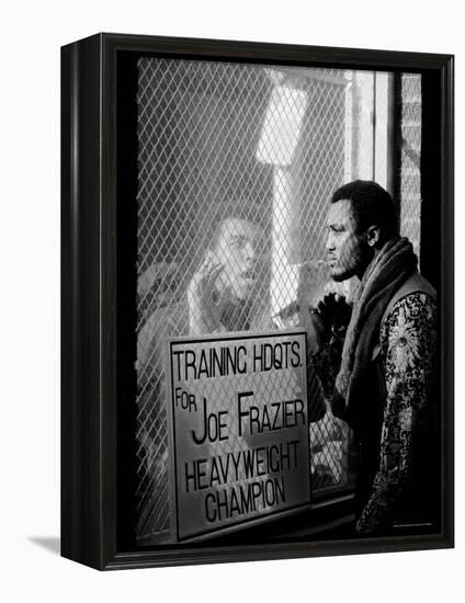 Boxer Muhammad Ali Taunting Rival Joe Frazier at Frazier's Training Headquarters-John Shearer-Framed Premier Image Canvas