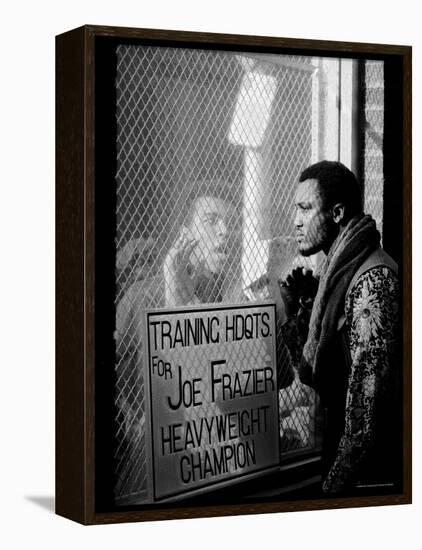 Boxer Muhammad Ali Taunting Rival Joe Frazier at Frazier's Training Headquarters-John Shearer-Framed Premier Image Canvas