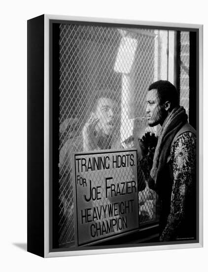 Boxer Muhammad Ali Taunting Rival Joe Frazier at Frazier's Training Headquarters-John Shearer-Framed Premier Image Canvas