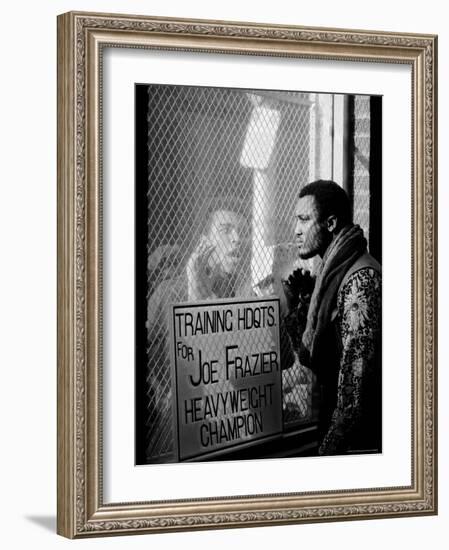 Boxer Muhammad Ali Taunting Rival Joe Frazier at Frazier's Training Headquarters-John Shearer-Framed Premium Photographic Print