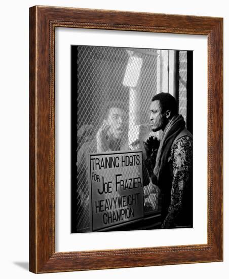 Boxer Muhammad Ali Taunting Rival Joe Frazier at Frazier's Training Headquarters-John Shearer-Framed Premium Photographic Print