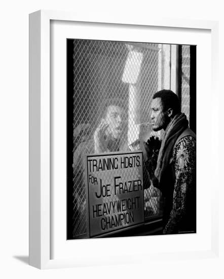 Boxer Muhammad Ali Taunting Rival Joe Frazier at Frazier's Training Headquarters-John Shearer-Framed Premium Photographic Print