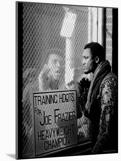 Boxer Muhammad Ali Taunting Rival Joe Frazier at Frazier's Training Headquarters-John Shearer-Mounted Premium Photographic Print