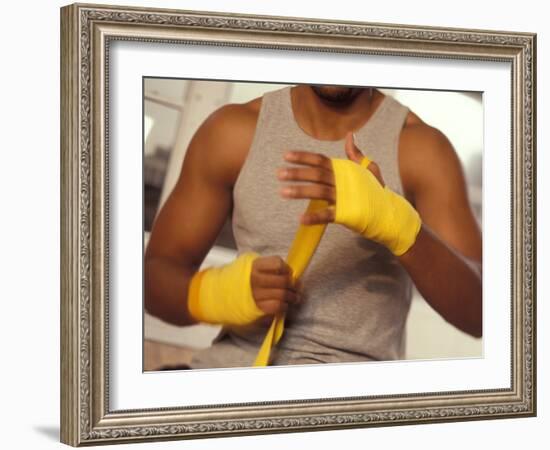 Boxer Wrapping His Hands-Chris Trotman-Framed Photographic Print