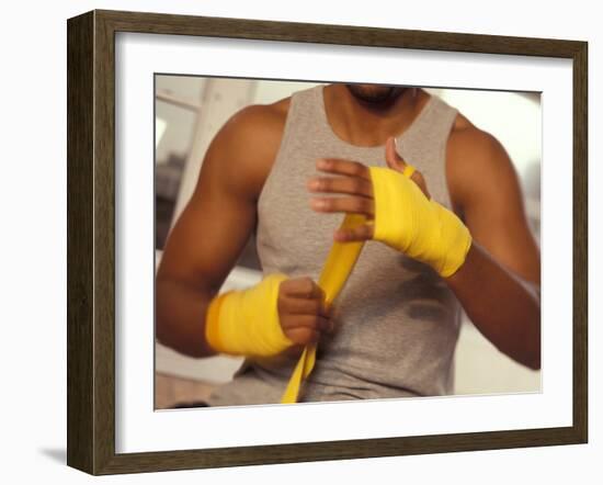 Boxer Wrapping His Hands-Chris Trotman-Framed Photographic Print