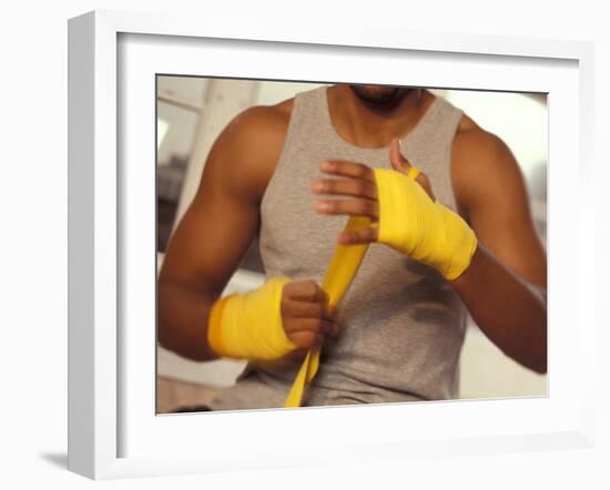 Boxer Wrapping His Hands-Chris Trotman-Framed Photographic Print