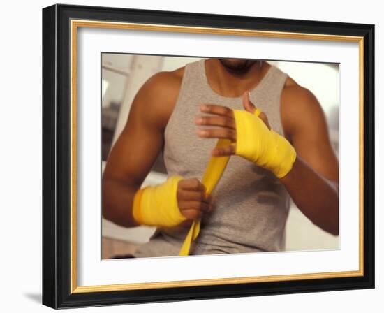 Boxer Wrapping His Hands-Chris Trotman-Framed Photographic Print