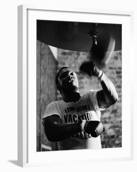 Boxing Champ Joe Frazier Working Out for His Scheduled Fight Against Muhammad Ali-John Shearer-Framed Premium Photographic Print