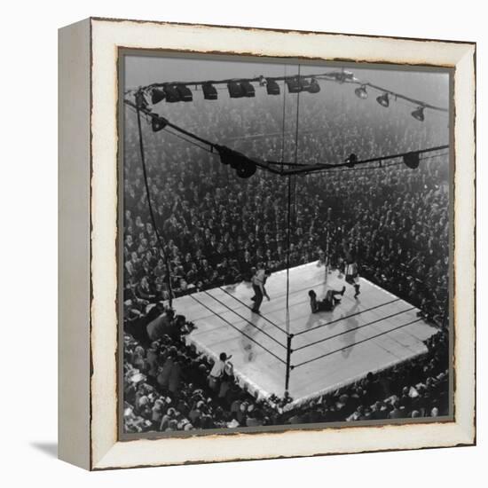 Boxing Ring as Heavyweight Champion Joe Louis Lies on Canvas, after Floored by Jersey Joe Walcott-Gjon Mili-Framed Premier Image Canvas