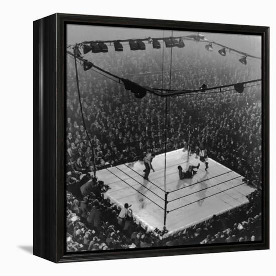 Boxing Ring as Heavyweight Champion Joe Louis Lies on Canvas, after Floored by Jersey Joe Walcott-Gjon Mili-Framed Premier Image Canvas