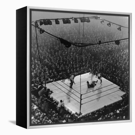 Boxing Ring as Heavyweight Champion Joe Louis Lies on Canvas, after Floored by Jersey Joe Walcott-Gjon Mili-Framed Premier Image Canvas