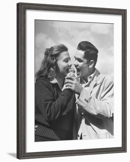 Boy and Girl Eating an Ice Cream Cone Together-Ed Clark-Framed Premium Photographic Print