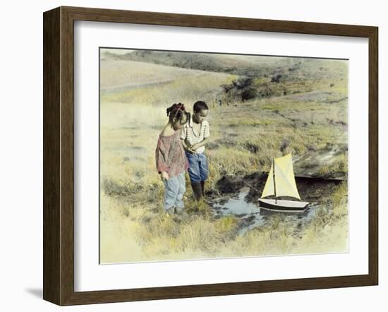 Boy and Girl Playing with Sail Boat-Nora Hernandez-Framed Giclee Print