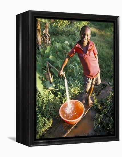 Boy at Water Tap, Chuka Village, Mount Kenya, Kenya, East Africa, Africa-Duncan Maxwell-Framed Premier Image Canvas