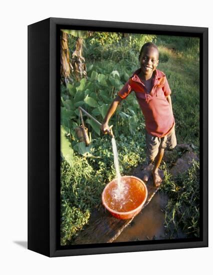 Boy at Water Tap, Chuka Village, Mount Kenya, Kenya, East Africa, Africa-Duncan Maxwell-Framed Premier Image Canvas